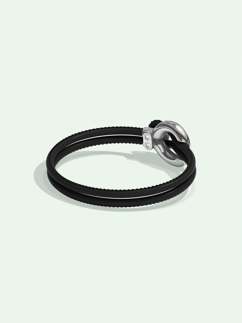 Imagine black leather bracelet by Orrling in a back view created in collaboration with the Non-Violence Project.