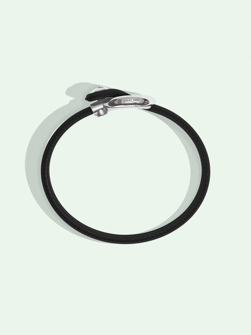 Imagine black leather bracelet by Orrling in a top view created in collaboration with the Non-Violence Project.