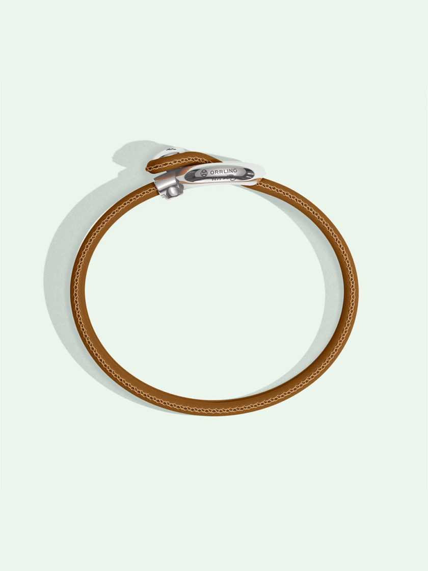 Imagine brown leather bracelet by Orrling in a top view created in collaboration with the Non-Violence Project.