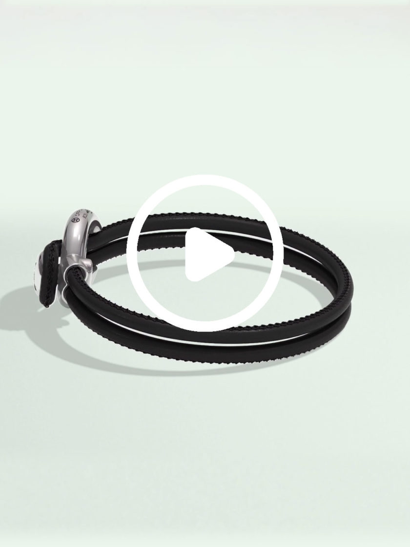 Imagine bracelet black leather by Orrling in a top view created in collaboration with the Non-Violence Project.