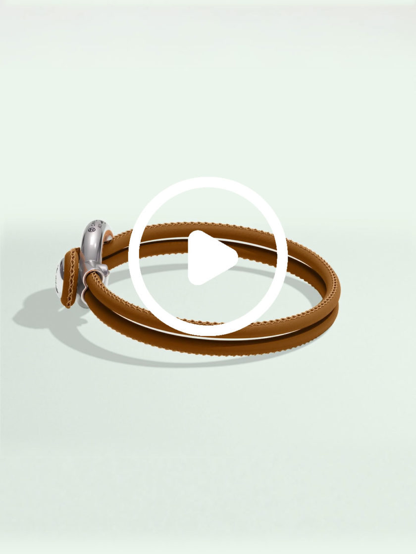 Imagine bracelet brown leather by Orrling in a top view created in collaboration with the Non-Violence Project.